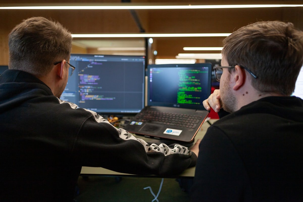 Students working through a programming exercise